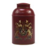 Toleware cannister and cover decorated with a crest, 44cm high