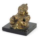 Victorian bronzed pen holder in the form of an Arab man, raised on a square black slate base, 9cm