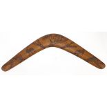 Australian Aboroginal wooden boomerang carved with animals, 57cm in length