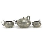 Arts & Crafts baronial pewter tea set, the largest 23.5cm in length