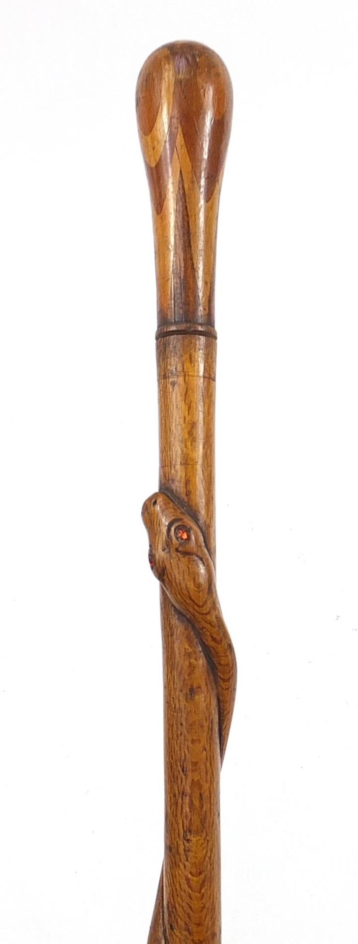 Hardwood walking stick with inlaid handle carved with a serpent, 85cm in length