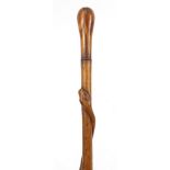 Hardwood walking stick with inlaid handle carved with a serpent, 85cm in length