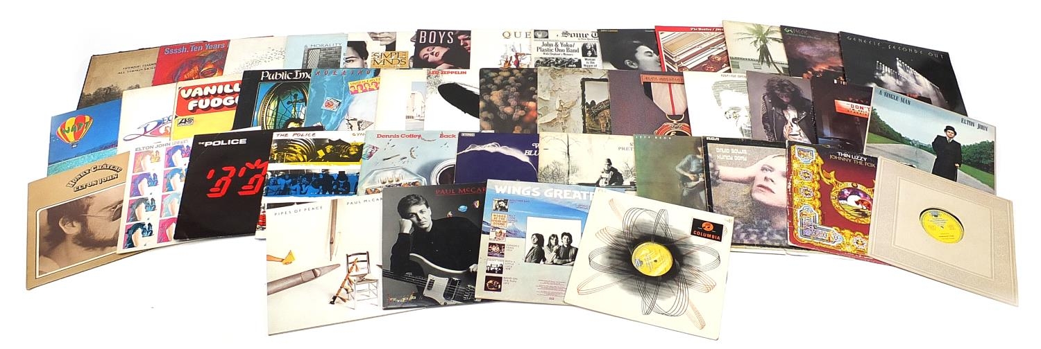 Vinyl LP records including Led Zeppelin, Genesis, Queen, The Beatles and David Bowie