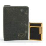 S T Dupont gold plated and black enamel lighter with box and paperwork, numbered K3GS20