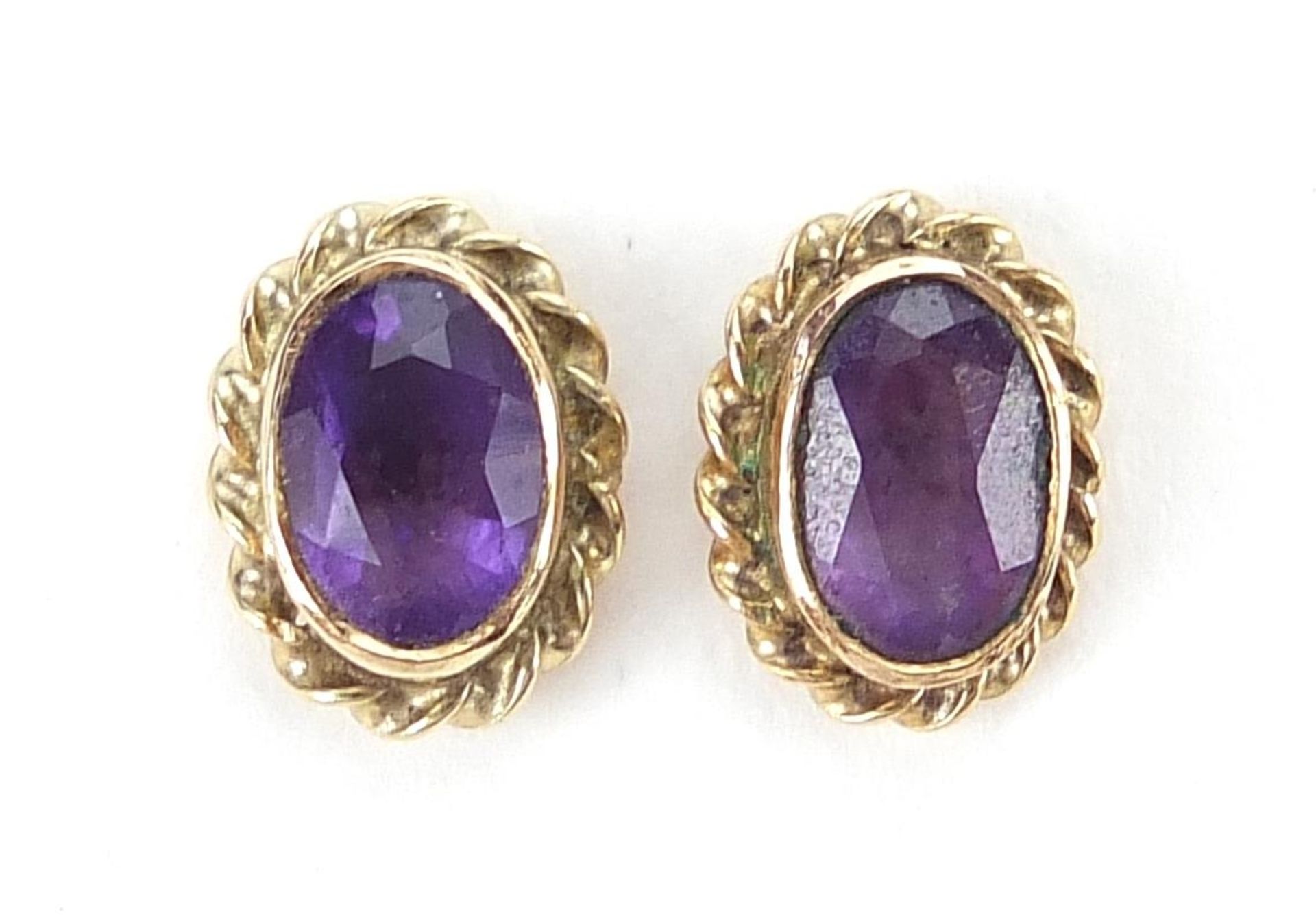 Pair of 9ct gold amethyst stud earrings, 8mm high, 1.1g