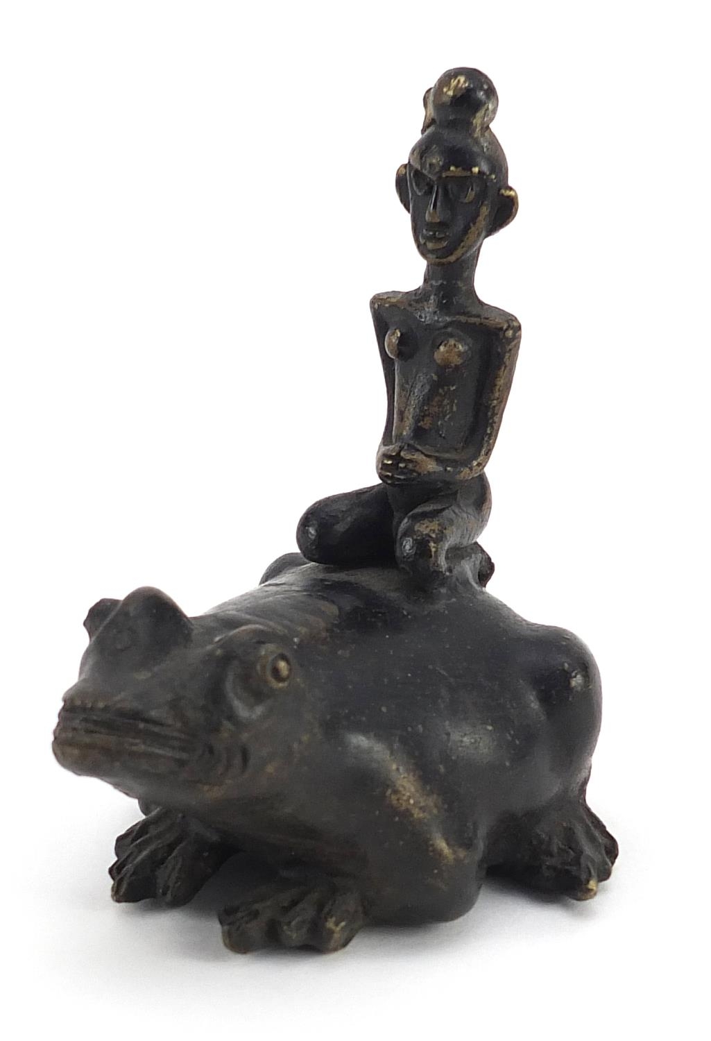 Tribal interest patinated bronze study of a tribesman on frog, 10cm high