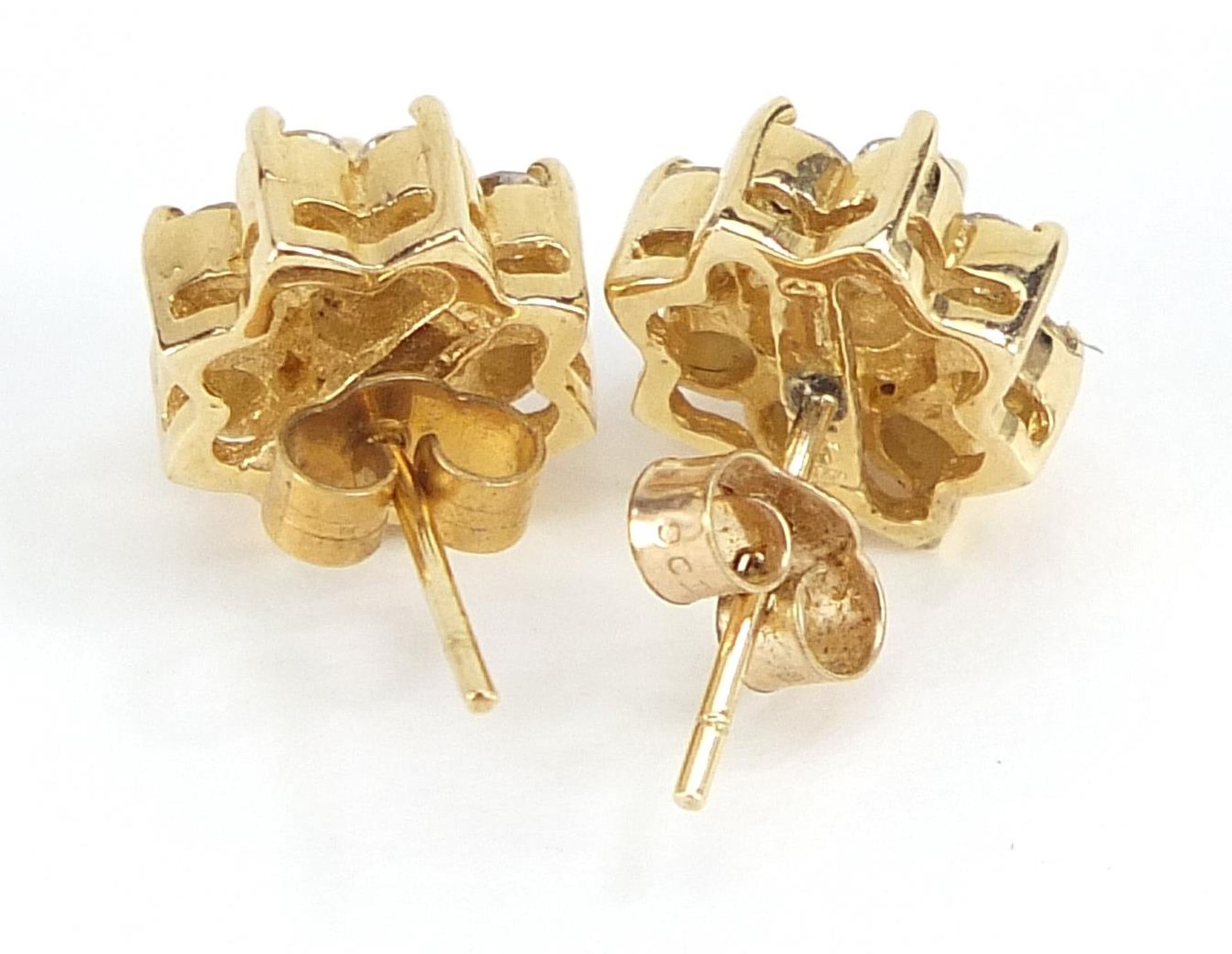 14ct gold diamond flower head stud earrings, the largest diamond approximately 3.7mm in diameter, - Image 2 of 3