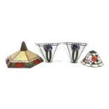 Four Tiffany design lampshades, the largest 44cm in diameter
