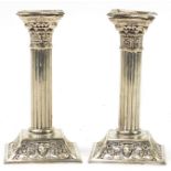 Pair of Corinthian column silver plated candlesticks, 18cm high
