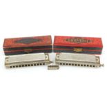 Two M Hohner Super Chromonica harmonicas with boxes