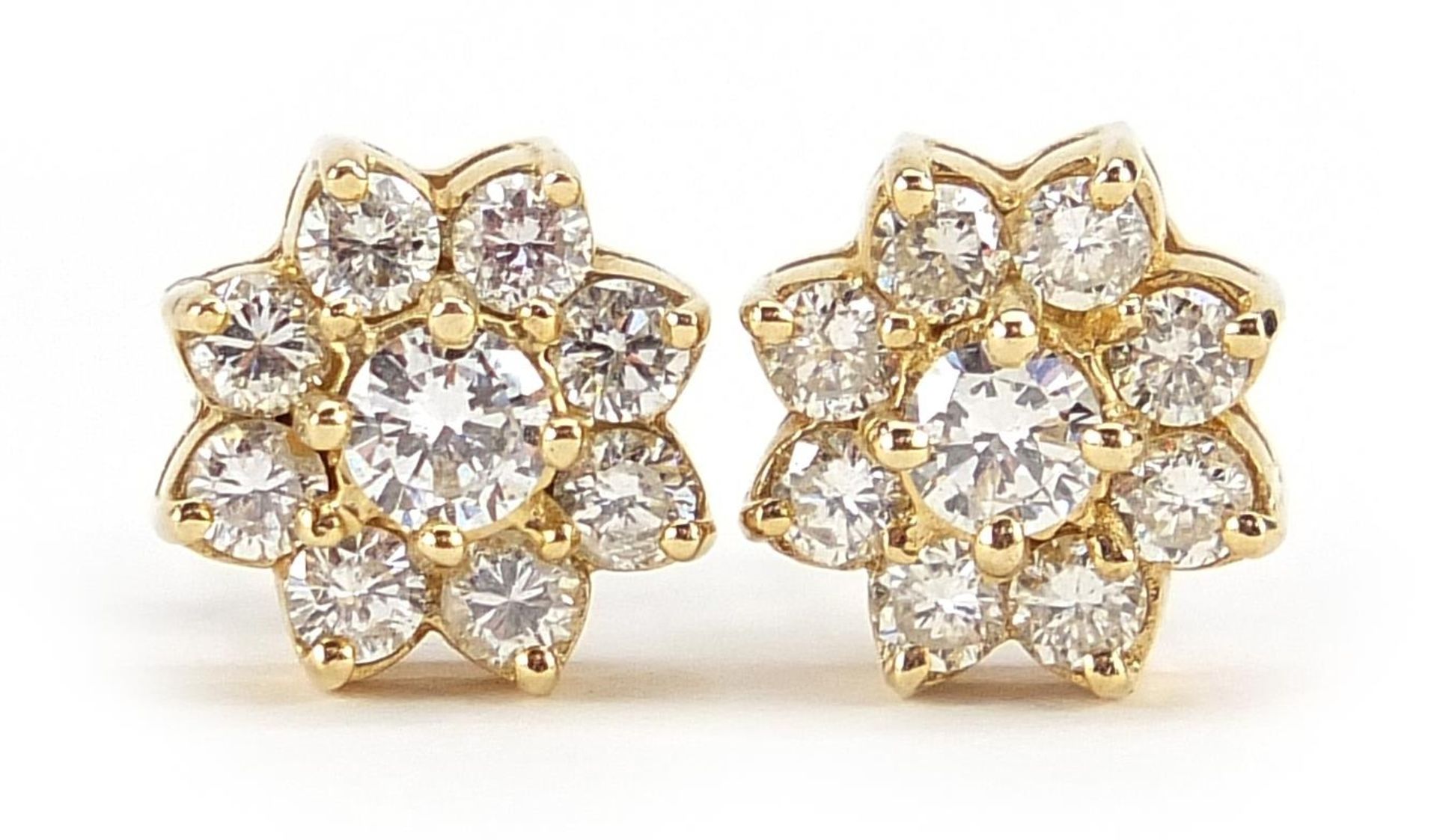 14ct gold diamond flower head stud earrings, the largest diamond approximately 3.7mm in diameter,