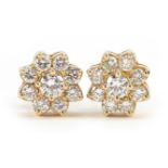 14ct gold diamond flower head stud earrings, the largest diamond approximately 3.7mm in diameter,