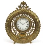 19th century pierced brass easel mantle clock with circular enamelled dial having Roman numerals,