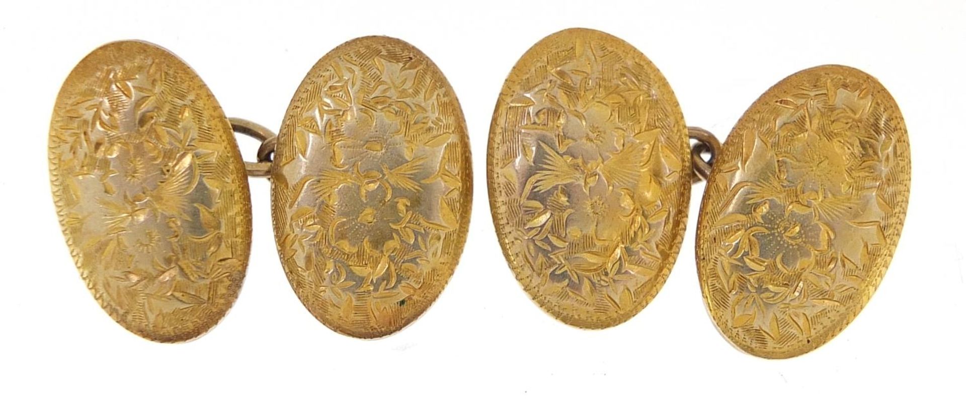 Pair of unmarked gold cufflinks engraved with flowers, (tests as 9ct gold) 1.5cm in length, 3.5g