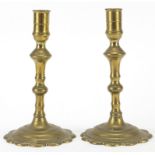 Pair of 18th century turned brass candlesticks, 19cm high