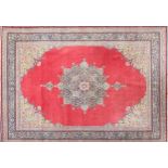 Large red ground carpet having a all over floral design, 360cm x 270cm