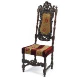 Victorian mahogany high back chair with needlepoint upholstered back and seat profusely carved