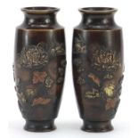 Pair of Japanese patinated bronze vases decorated in relief with birds and flowers, 15cm high