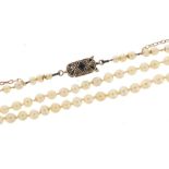 Seed pearl two strand necklace with Art Deco white gold blue and clear sapphire clasp and 9ct yellow