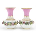 Pair of 19th century French pink ground vases with floral encrusted band, each 16cm high