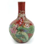 Large Chinese porcelain vase decorated in relief with phoenixes amongst flowers, character marks