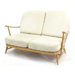 Ercol light elm Windsor two seater settee, 134cm wide