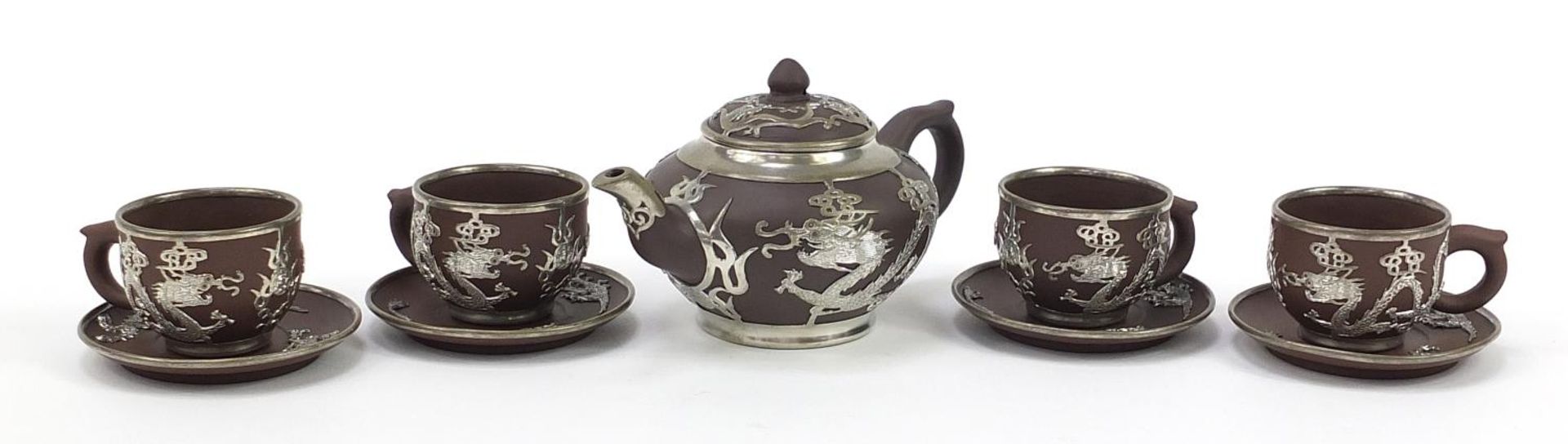 Chinese Yixing terracotta four place tea service with pewter dragon design overlay, various