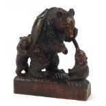 Large Black Forest carving of three bears and a fish, 37cm high