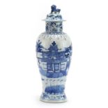 Chinese blue and white porcelain baluster vase and cover hand painted with figures in a palace