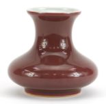 Chinese porcelain vase having a sang de boeuf glaze, six figure character marks to the base, 9cm