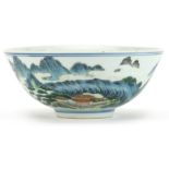 Chinese porcelain bowl hand painted in the famille rose palette with a continuous mountainous