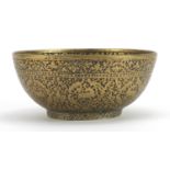 Islamic brass bowl engraved with wild animals and calligraphy, 14cm in diameter