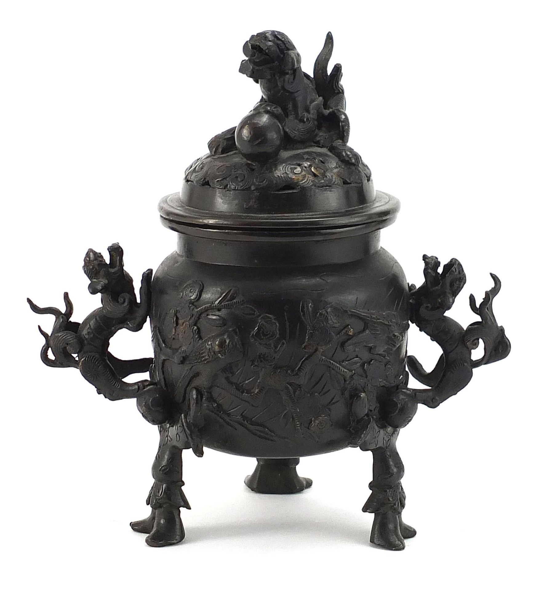 Japanese patinated bronze tripod incense burner with dragon handles and pierced lid, 21.5cm high