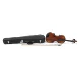 German violin with two piece back, bow and case, the violin bearing a Stradivarius paper label,