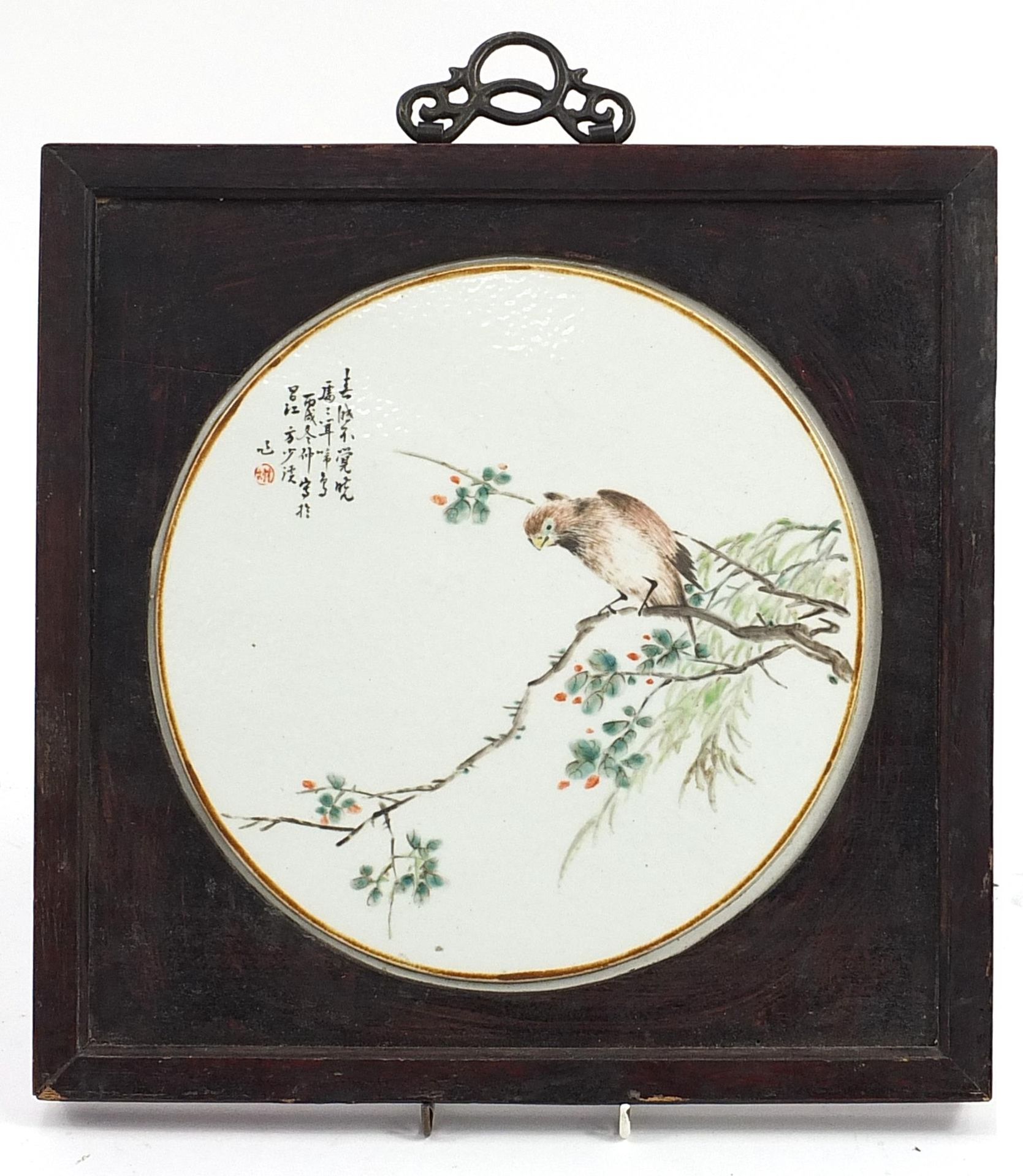 Chinese circular porcelain panel housed in a hardwood frame, the panel hand painted in the famille