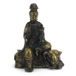 Chinese patinated bronze study of Guanyin seated on an elephant, 29.5cm high