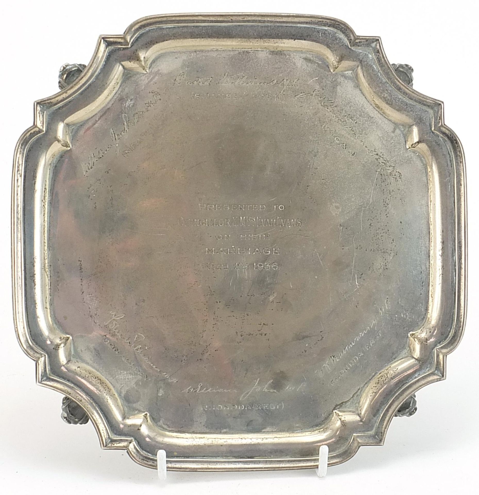 S Blanckensee & Son Ltd, George V square silver salver raised on four scroll feet, Chester 1930,