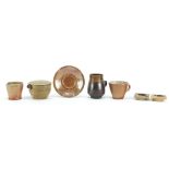 Studio pottery including jugs by Mary Rich and Phil Rogers and a pair of candleholders, the