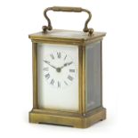 French brass cased carriage clock with enamelled dial having Roman numerals, 11cm high