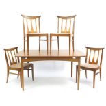 G Plan E-Gomme, mid century teak extending dining table with four chairs, the table 73.5cm H x 147cm