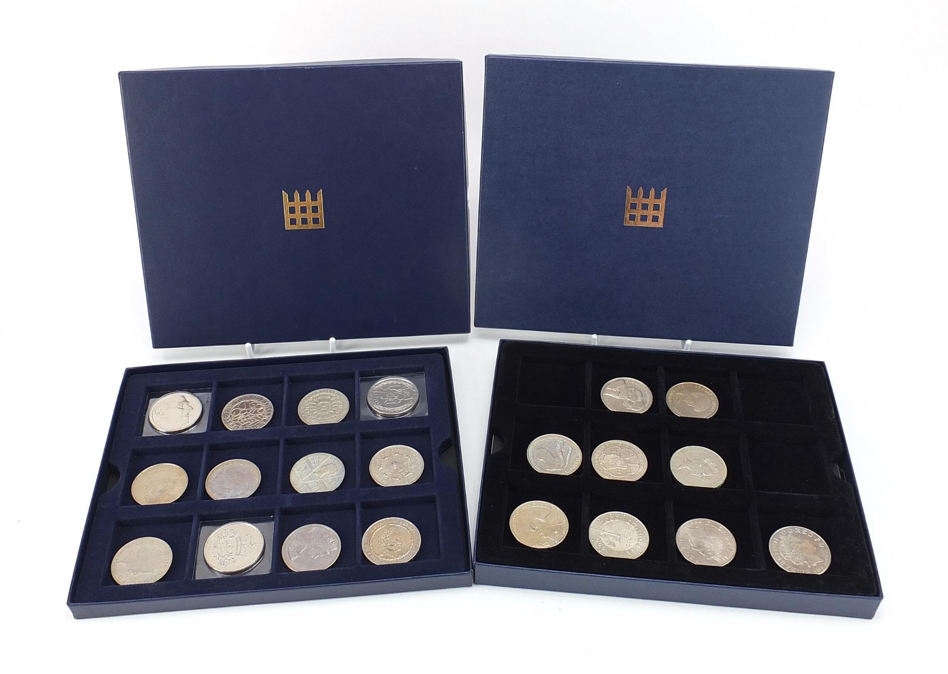 Twenty one United Kingdom commemorative five pound coins