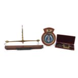 Sundry items including a naval interest cast metal Alaric plaque, mahogany and metal spirit level