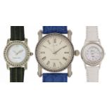 Three silver wristwatches set with blue sapphires, topaz and aquamarine, with certificates