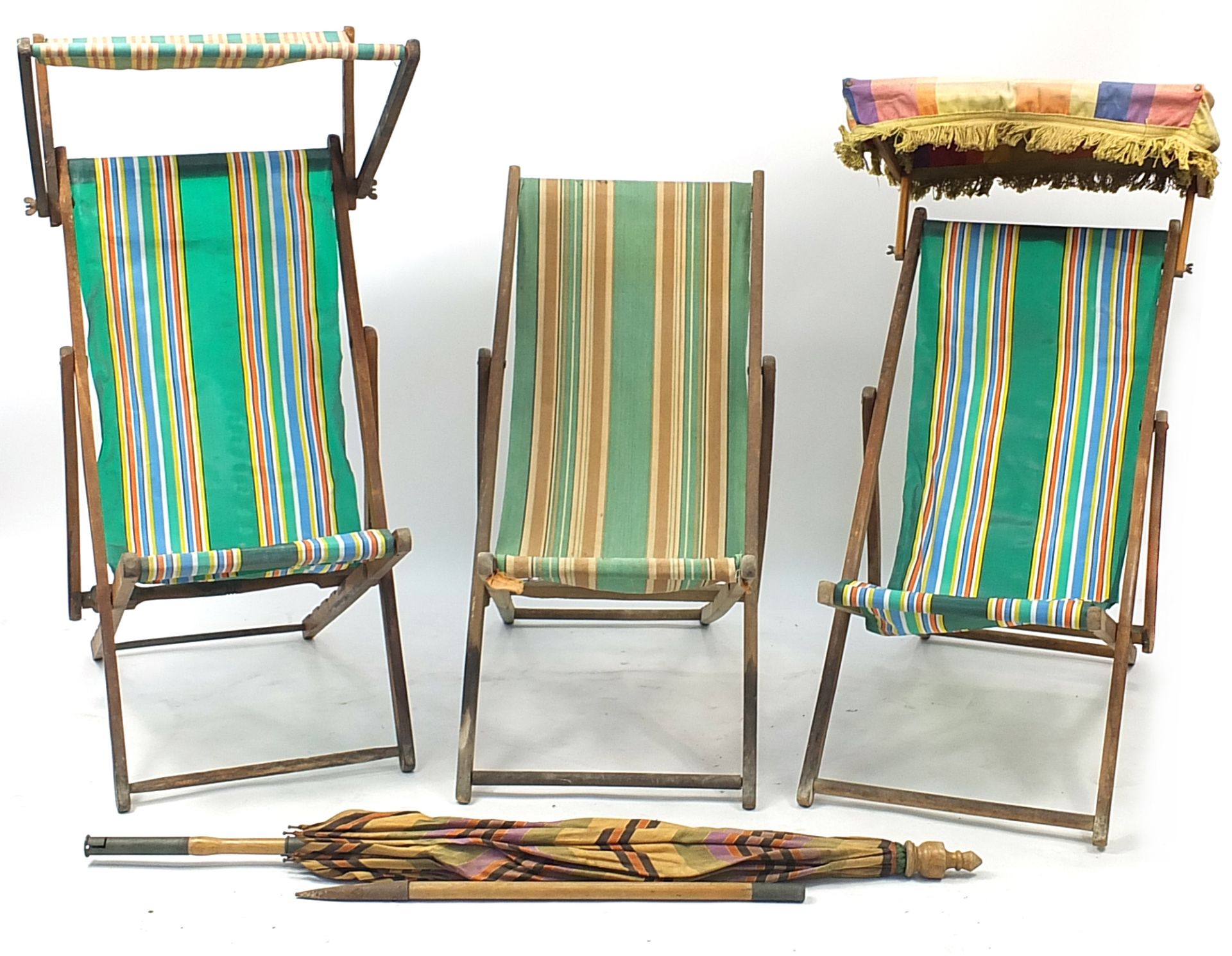 Three vintage teak folding deck chairs and parasol