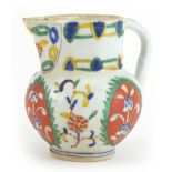 Turkish Kutahya pottery jug hand painted with flowers, 11.5cm high
