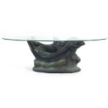 Contemporary dolphin coffee table with oval glass top, 38cm H x 122cm W x 61cm D