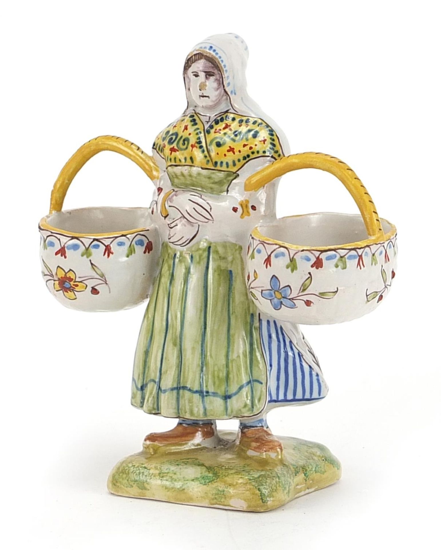 French faience glazed double table salt in the form of a maid holding two baskets, inscribed
