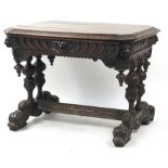 Oak centre table with frieze drawer, carved with lion heads and dolphin feet, 74cm H x 102cm W x 71