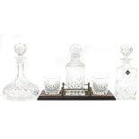 Stuart Crystal decanter and two tumblers on tray together with two Edinburgh Crystal decanters