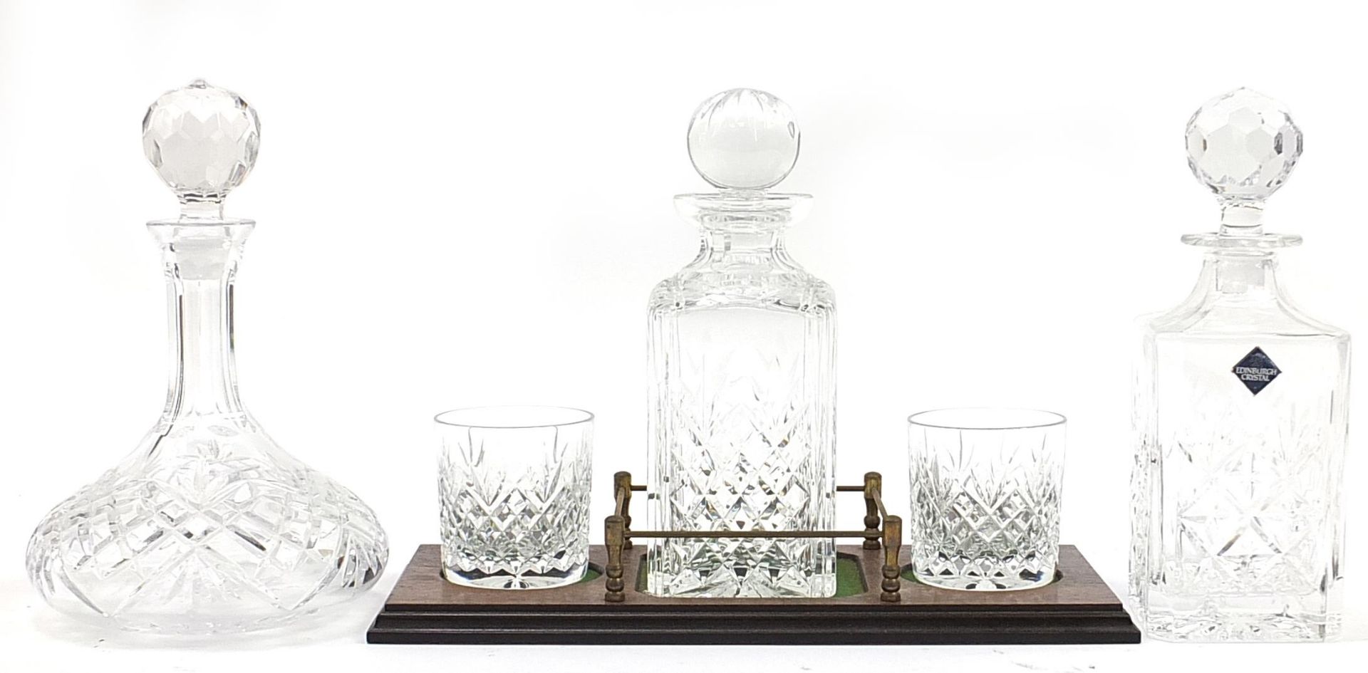 Stuart Crystal decanter and two tumblers on tray together with two Edinburgh Crystal decanters
